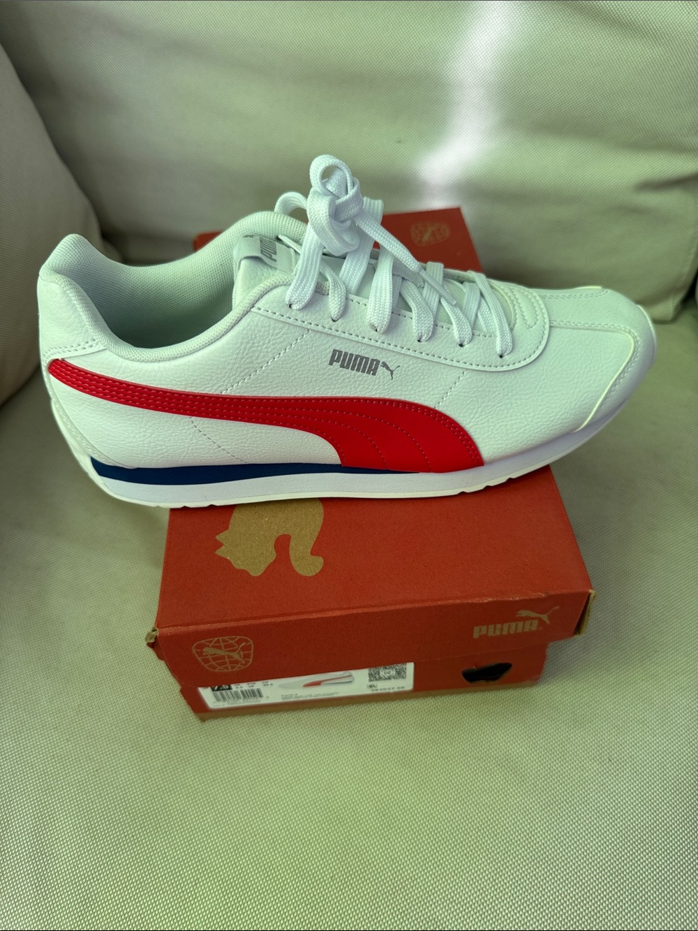 Puma White Trainer with Red Stripe and Blue Midsole Accent